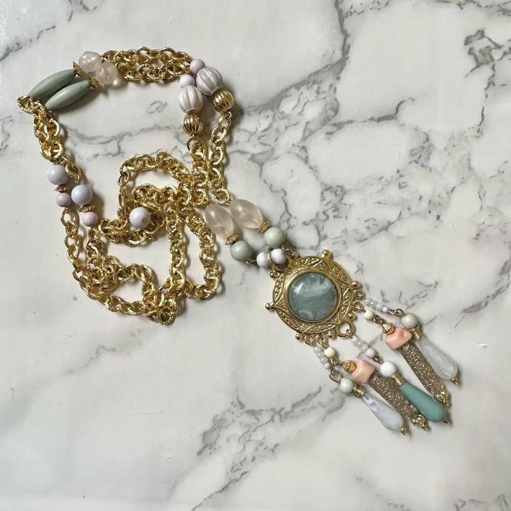 Gold tone long beaded pendant necklace